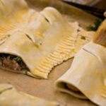 Brushing the sausage roll pastry