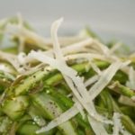 Raw Asparagus Salad topped with Parmesan