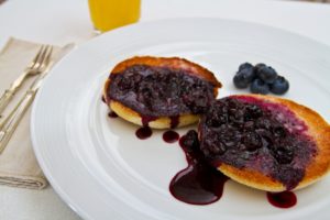 Blueberry sauce over toasted muffins