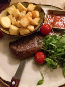 steak with patatas bravas