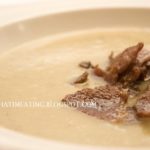 Jerusalem artichoke and leek soup topped with collar bacon