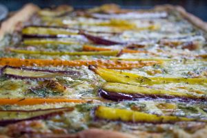 Rainbow carrots in cheese and herb tart