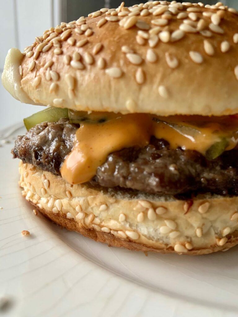 Swaledale burger with cheese and gherkins